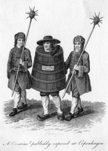 A criminal publicly exposed at Copenhagen, made to walk through the streets in a barrel with a guard on either side of him. late 18th century
